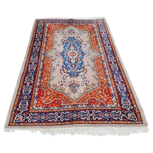 Vintage Pakistani Lahore rug with central medallion and floral motifs

