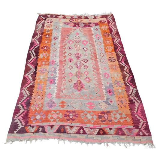 Close-up of diamond motif in pink and orange on vintage Anatolian kilim

