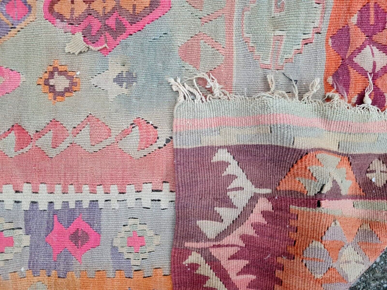 Anatolian rug with faded earth-tone color palette

