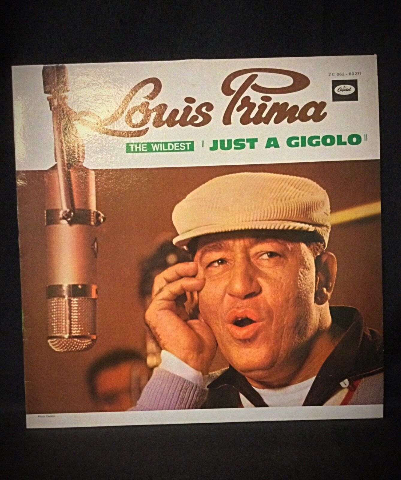 Side angle of Louis Prima "The Wildest" vinyl record showing the grooves
