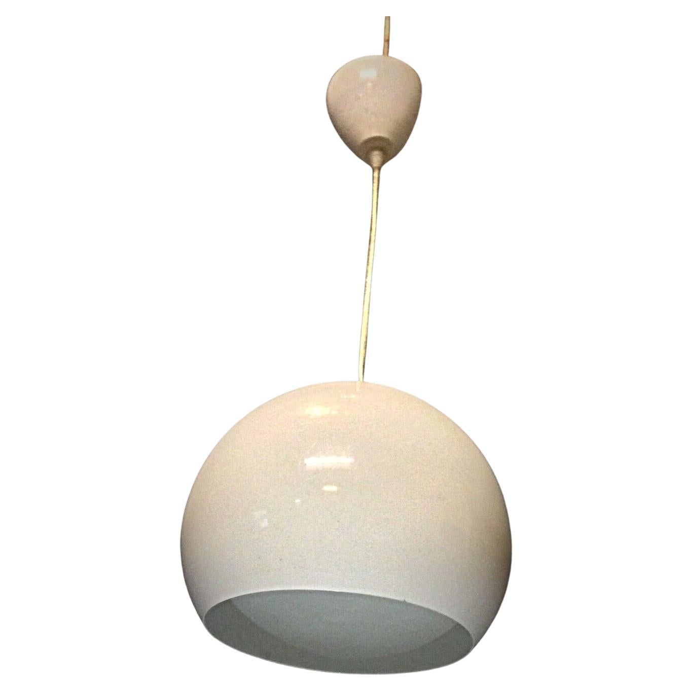 Close-up of vintage 60's enamel metal hanging lamp showing patina

