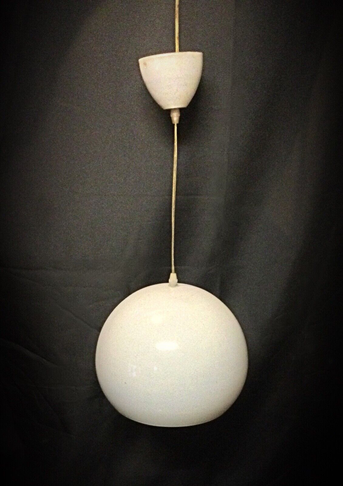Detailed shot of the enamel finish on the metal lamp shade
