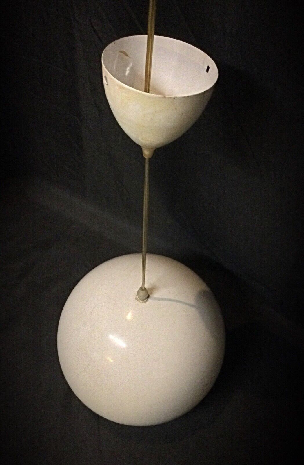 Close-up of the light bulb holder on the vintage hanging lamp
