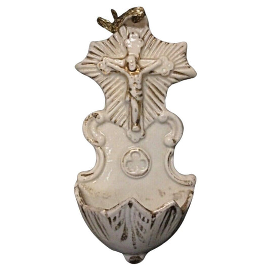 Front view of small wall-mounted porcelain Christ with esoteric container.
