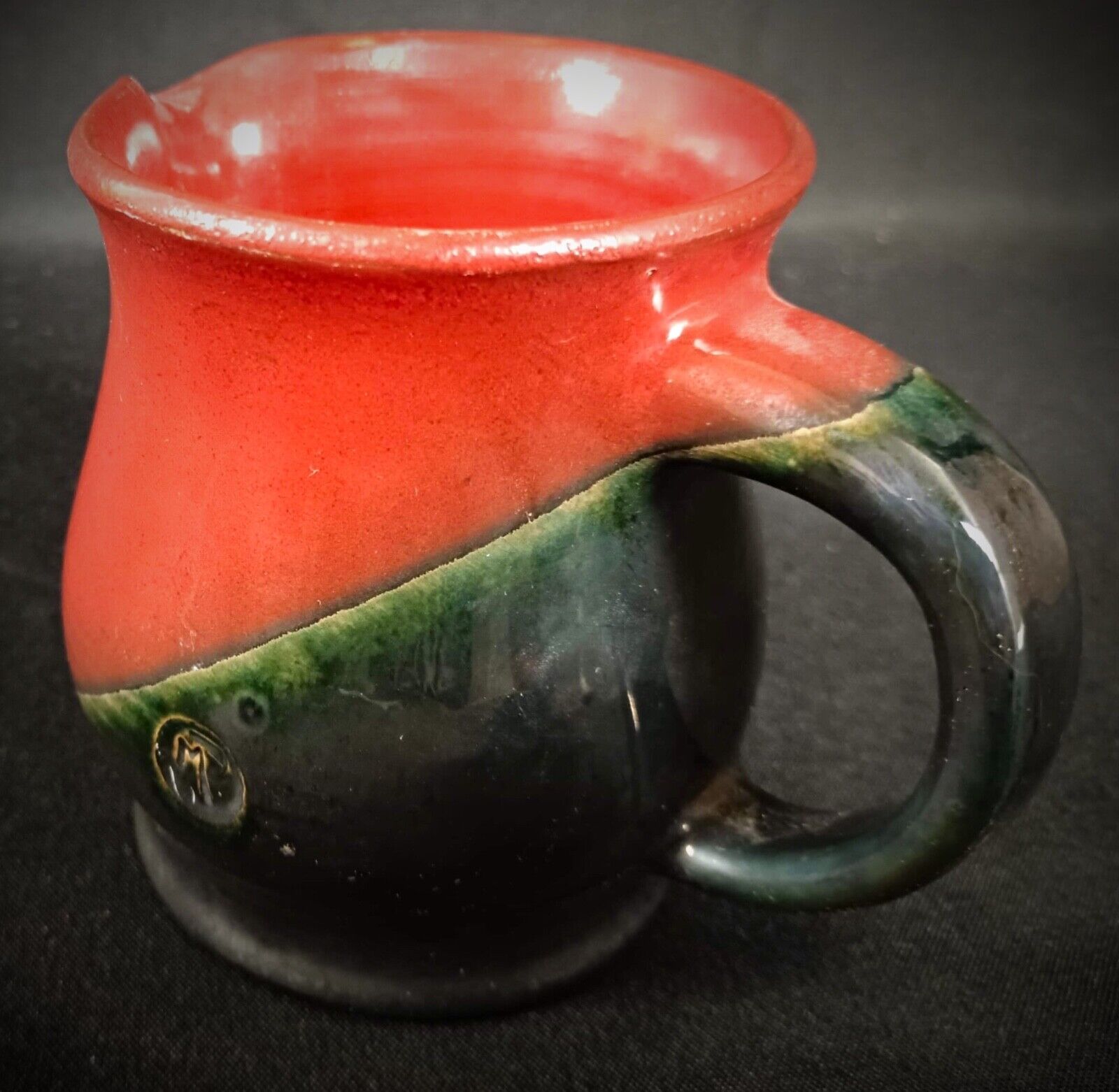Artistic ceramic pitcher by Michel Poully — sleek, minimalist design
