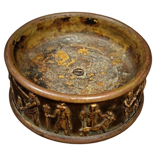 Antique Egyptian-themed brass trinket dish with serpent design.
