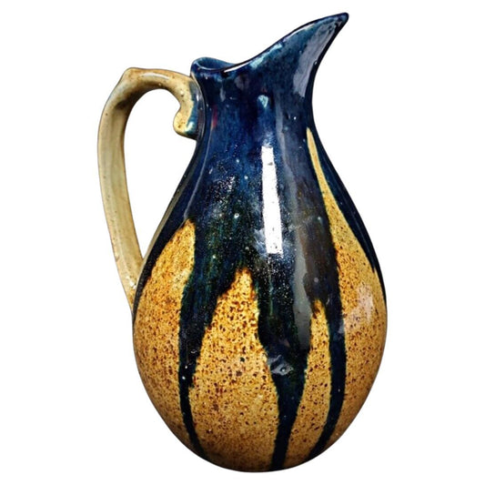 Vintage enamel terracotta pitcher with blue and brown glaze

