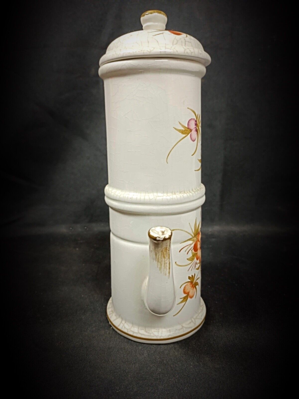 Decorative ceramic teapot with hand-painted floral motifs

