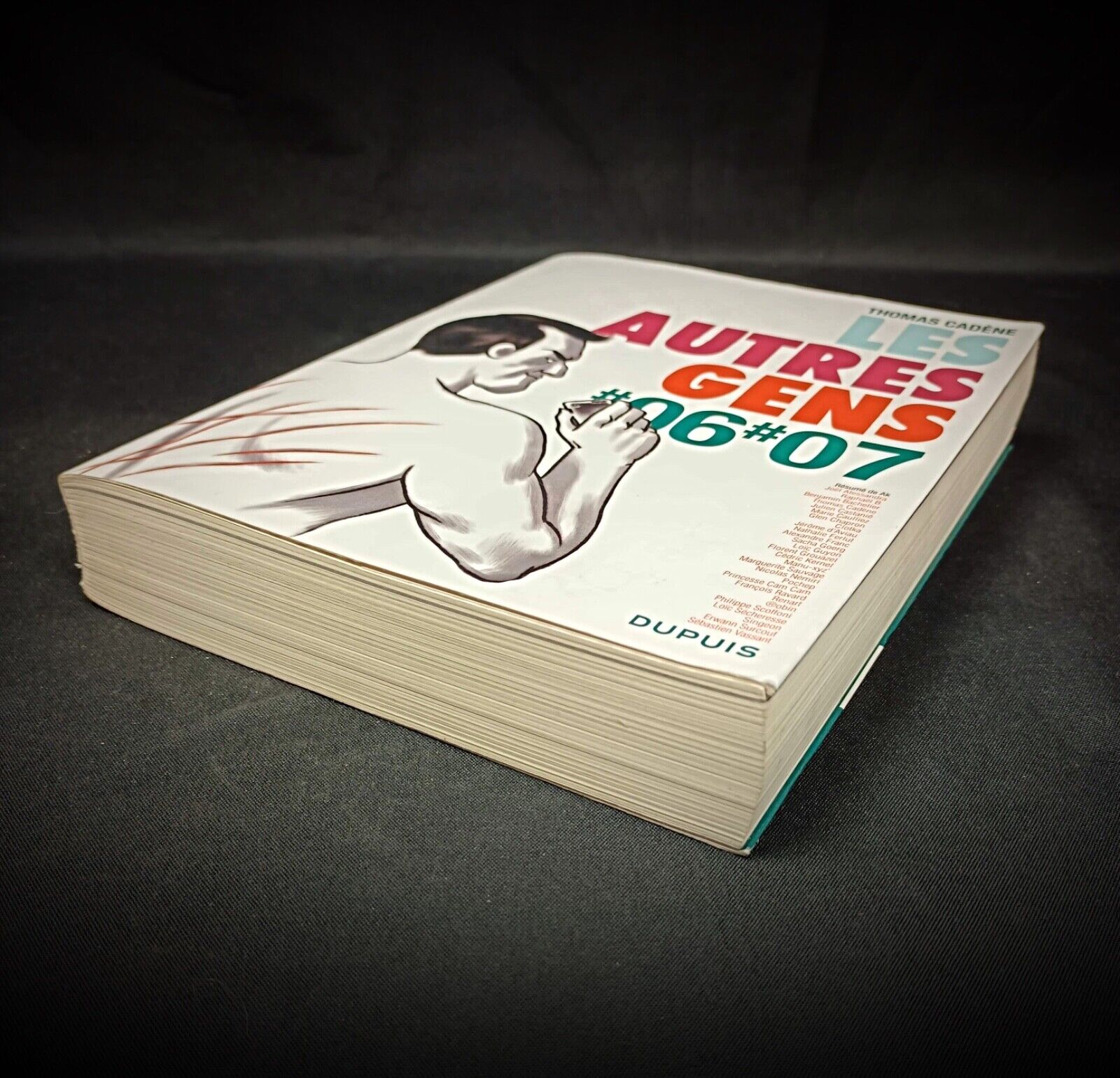Softcover comic book with multi-artist design


