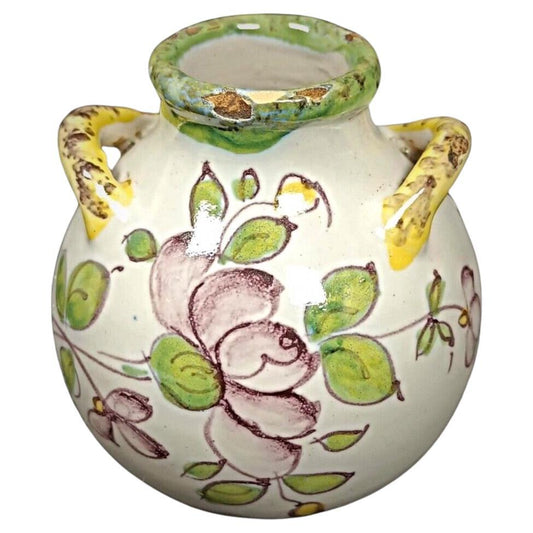 Vintage enameled earthenware pot with floral design

