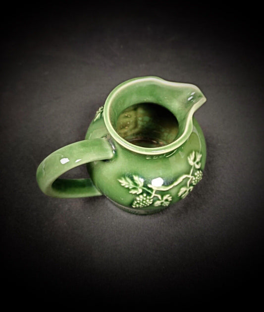 Hand-painted enameled ceramic jug with grapes

