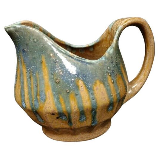 Vintage crackled glaze terra cotta jug with teal and ochre tones

