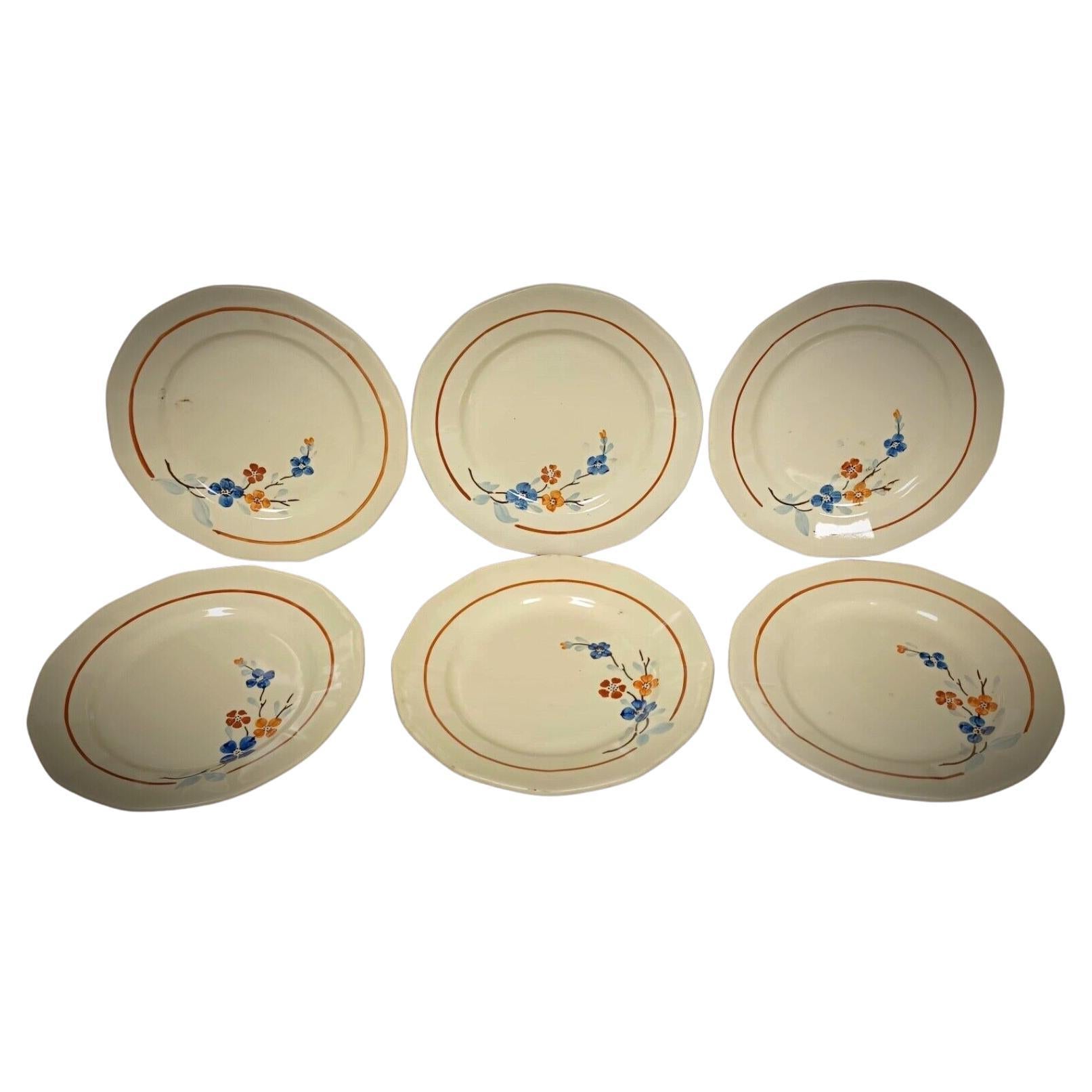 Vintage Sarreguemines plate with red rose and green leaves

