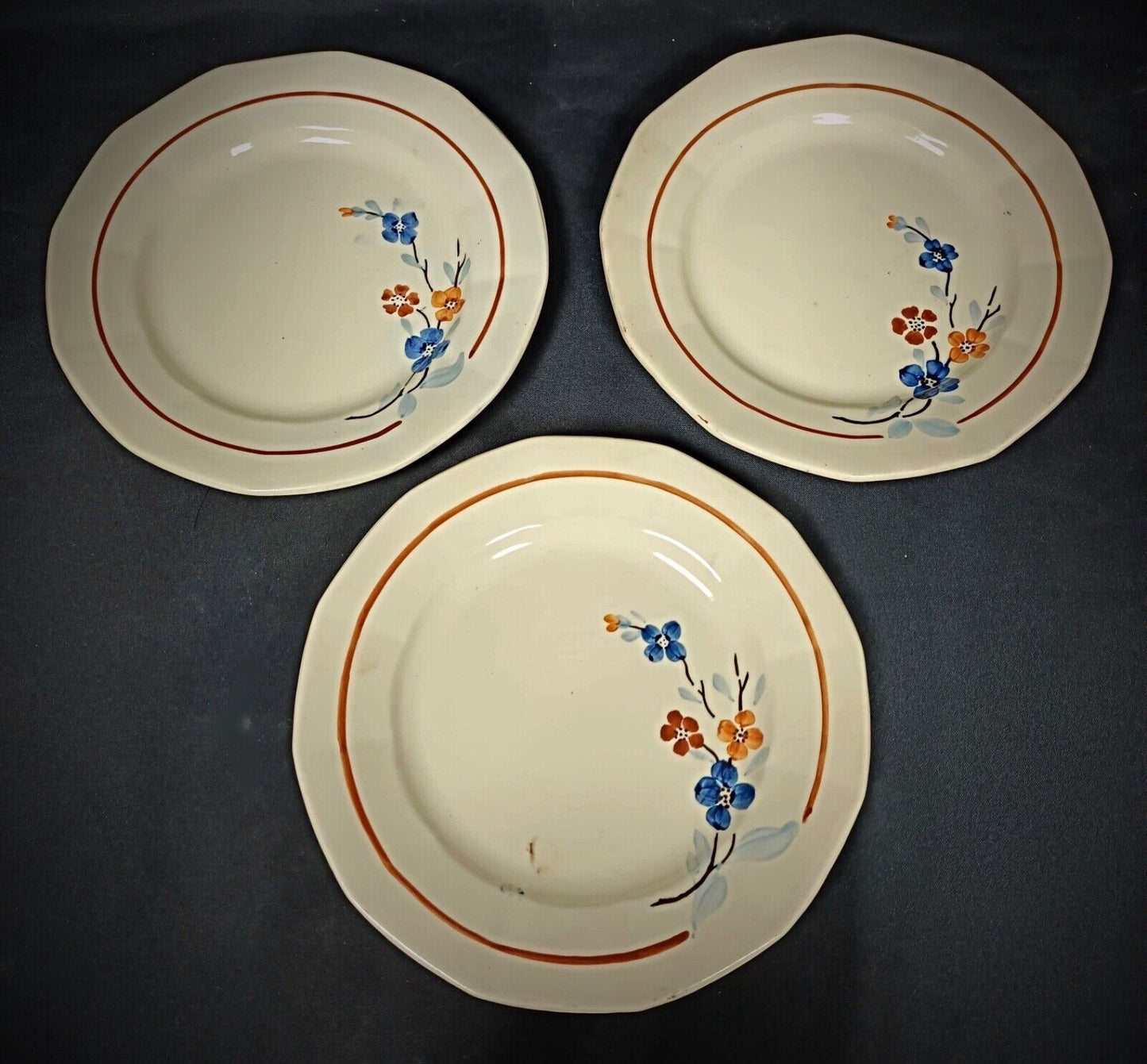 Close-up of delicate blue and yellow flowers on French plate

