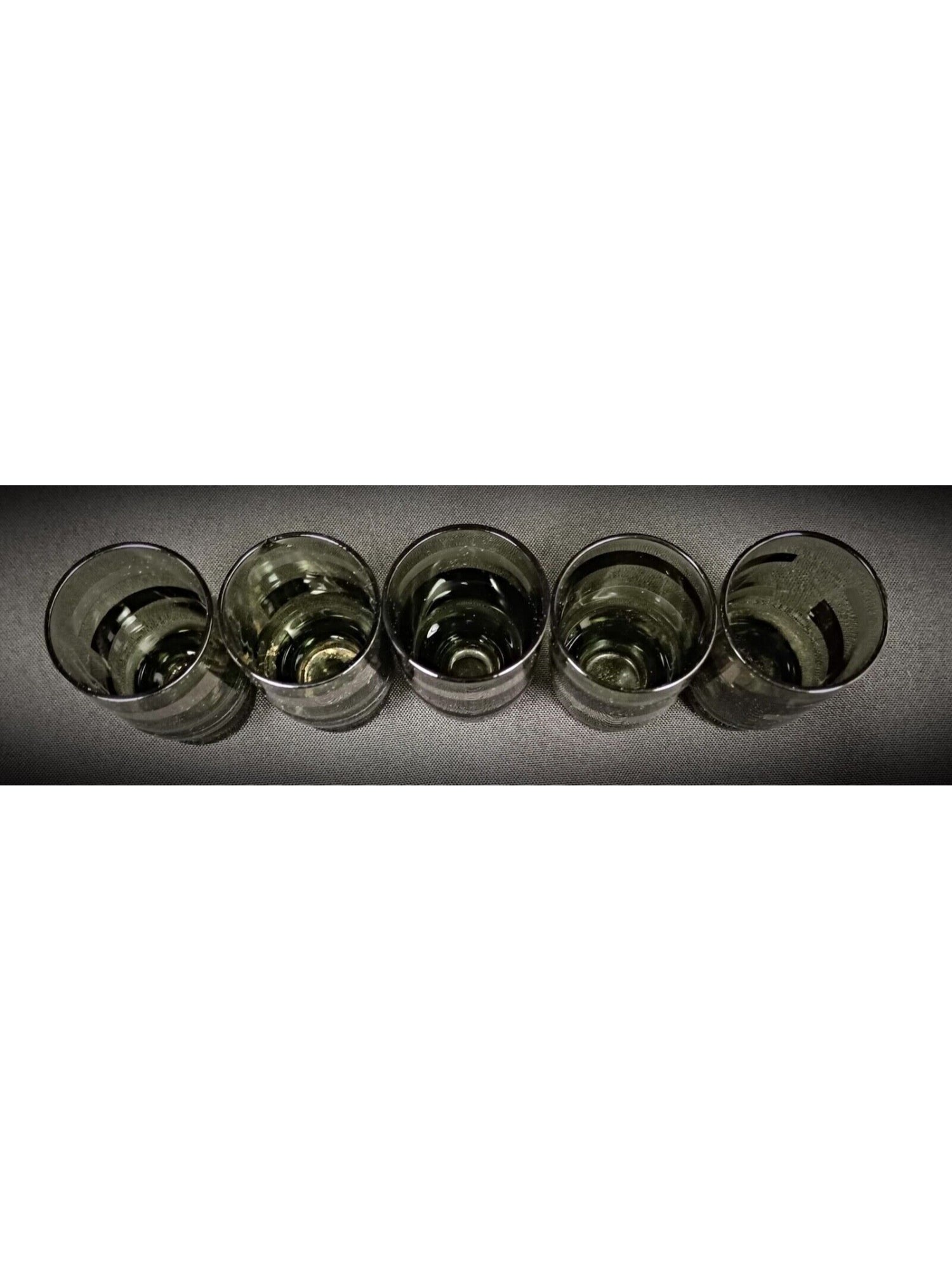 Thin stem and small round base of green liqueur glass


