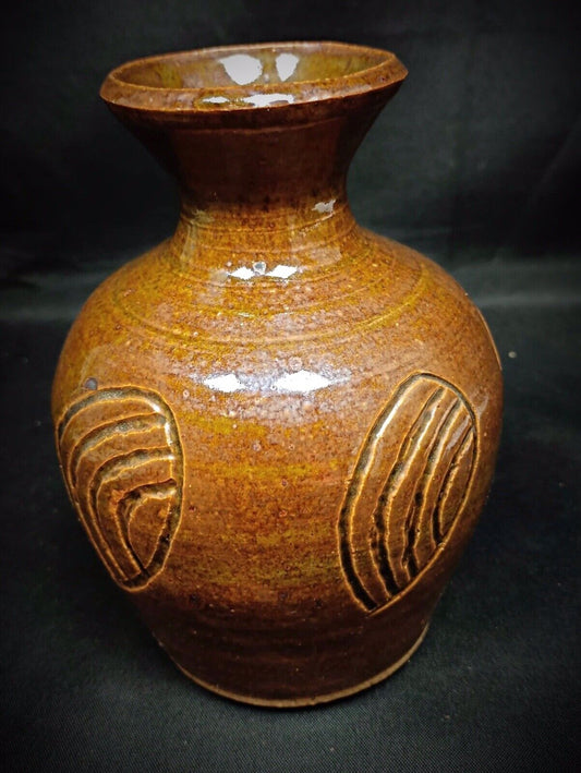 Compact enamelled vase showing smooth brown glaze texture