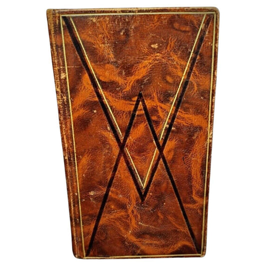 Burgundy cloth-bound vesperal missal with gilt lettering
