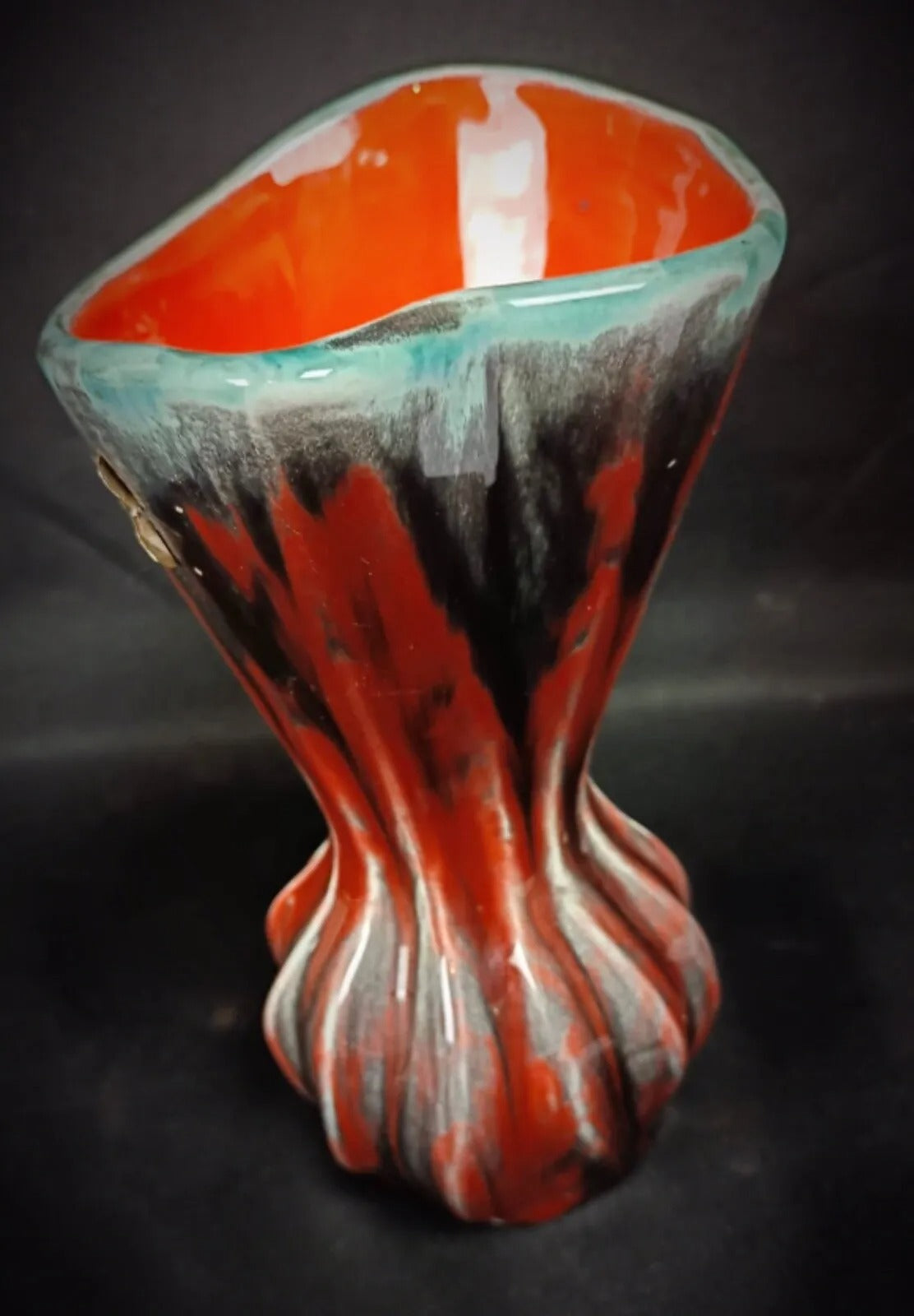 Side profile showing elegant vase form

