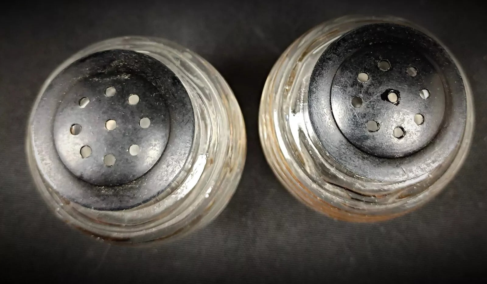 Interior of glass containers needing cleaning

