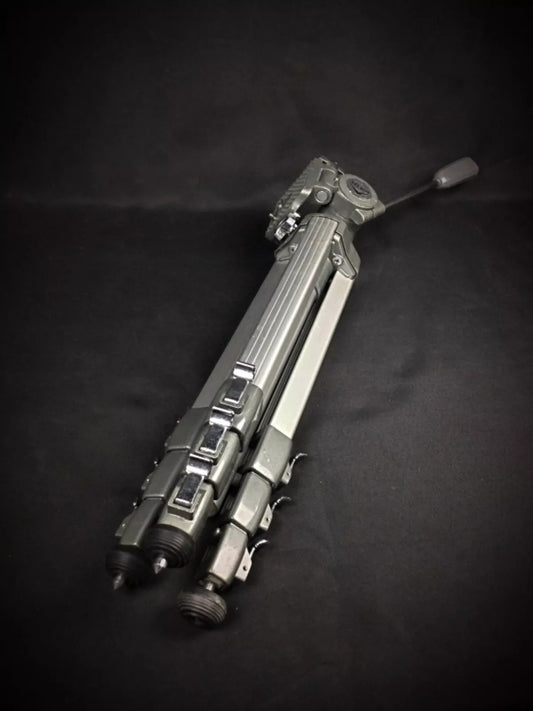 Close-up detail of the tripod's head and camera mounting plate.

