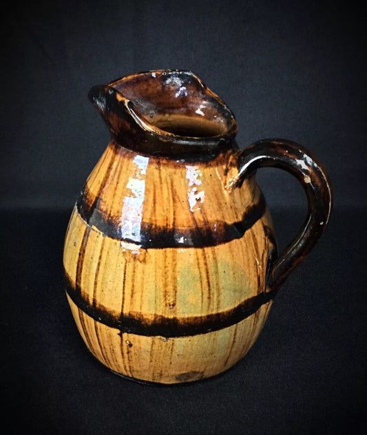 Close-up of pitcher's spout and rim detailing

