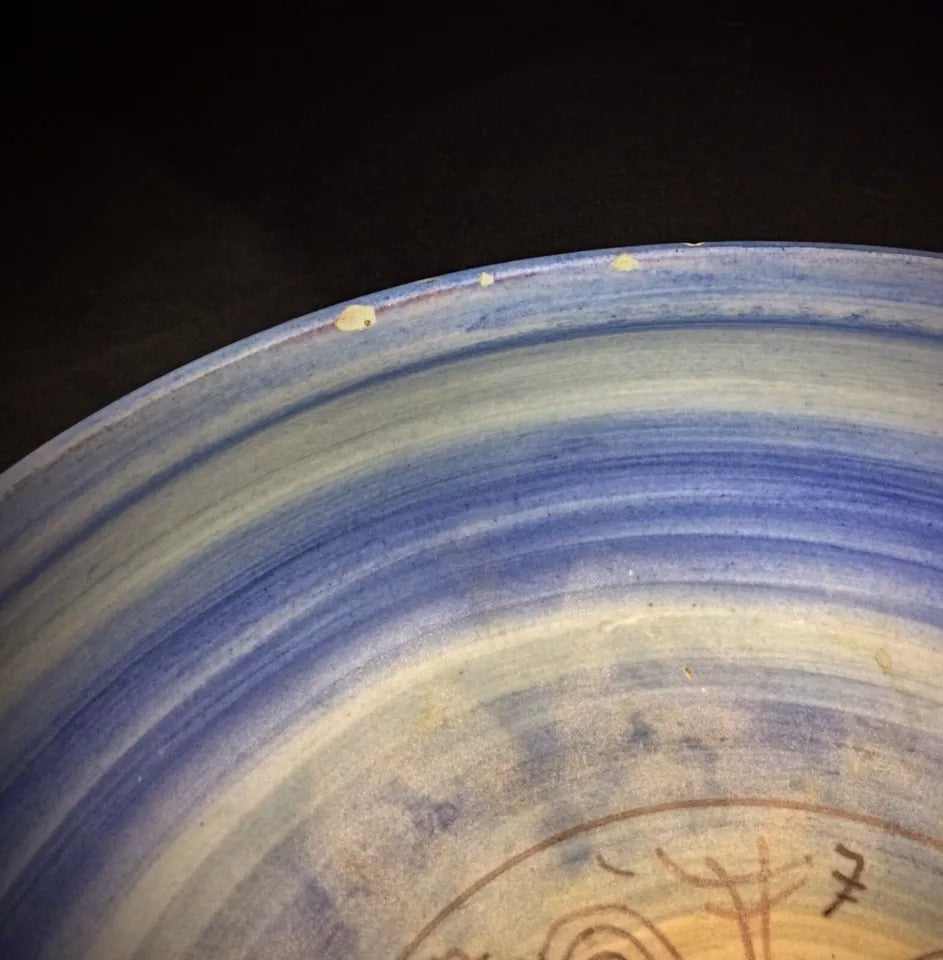 Detail of the glaze pooling and variegation inside the bowl's center.


