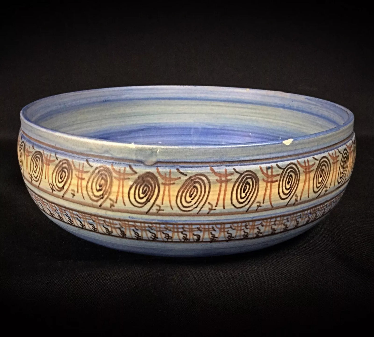 Texture shot showing the handcrafted marks and surface of the earthenware.

