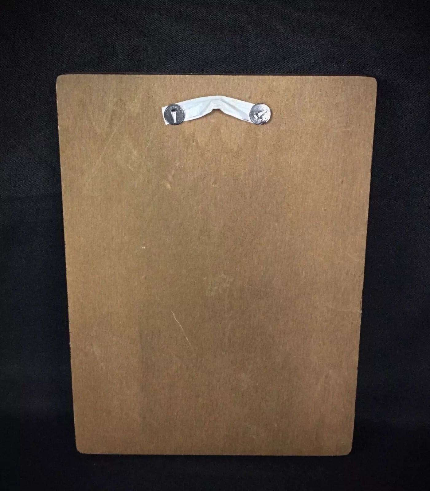 Close-up of the Christ Child's face pressed against the Virgin's cheek.

