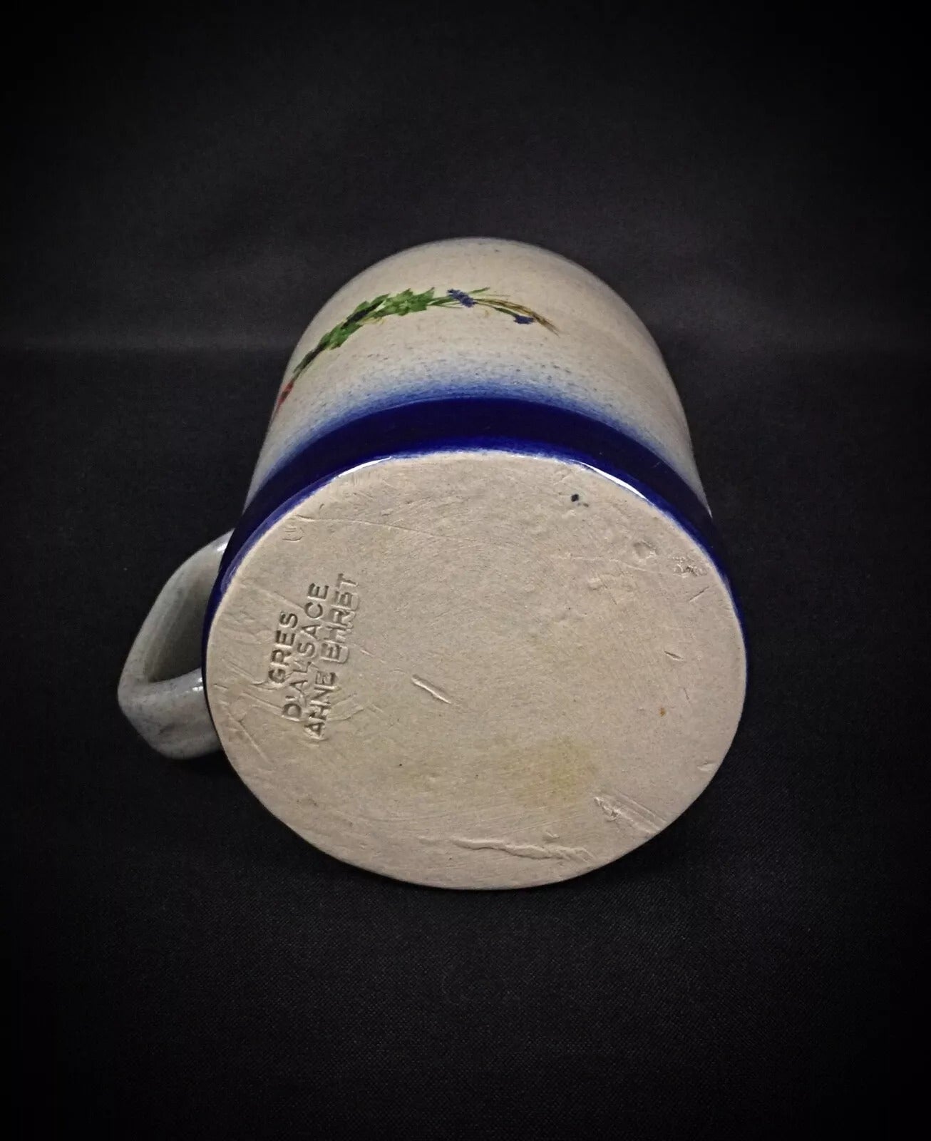 Close-up detail of the whimsical stylized floral bouquet in cobalt blue.

