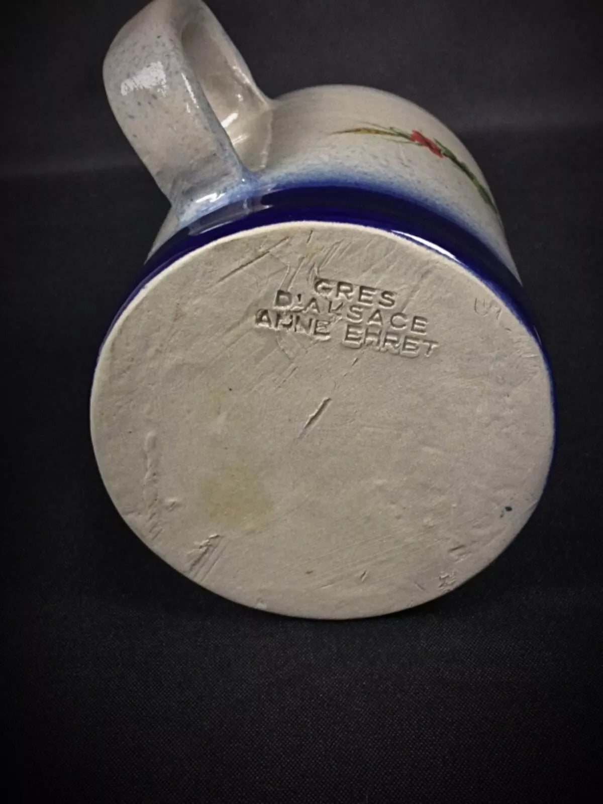 Texture shot highlighting the contrast between the smooth glaze and rustic stoneware body.

