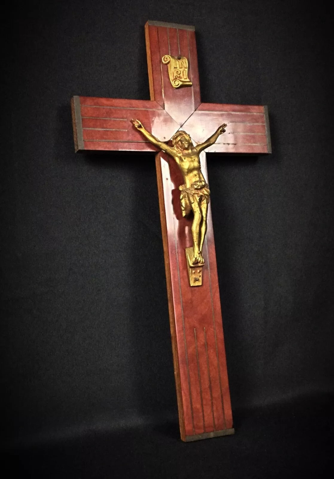 Close-up of the textured geometric and floral motifs on the cross arms.

