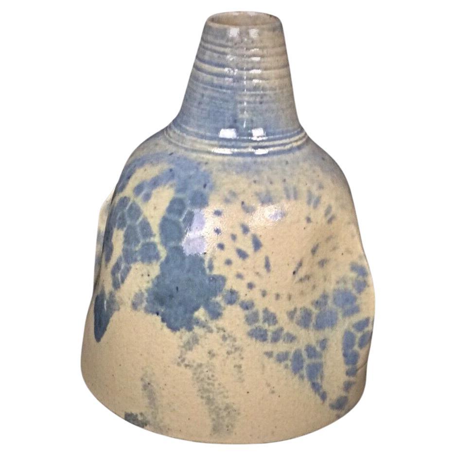 Full frontal view of the blue and white faience soliflore vase

