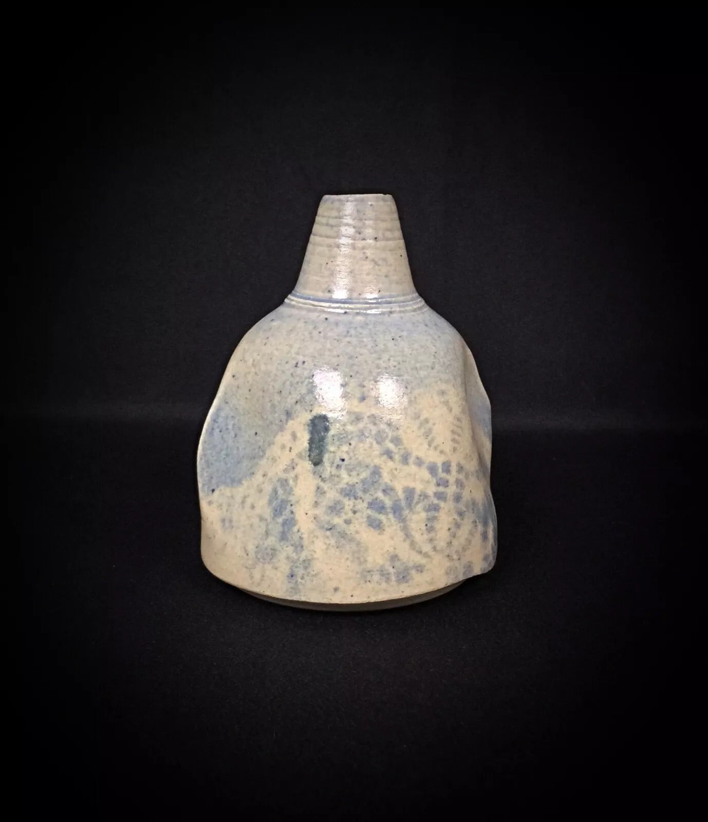 Close-up detail of the hand-painted floral spray in cobalt blue

