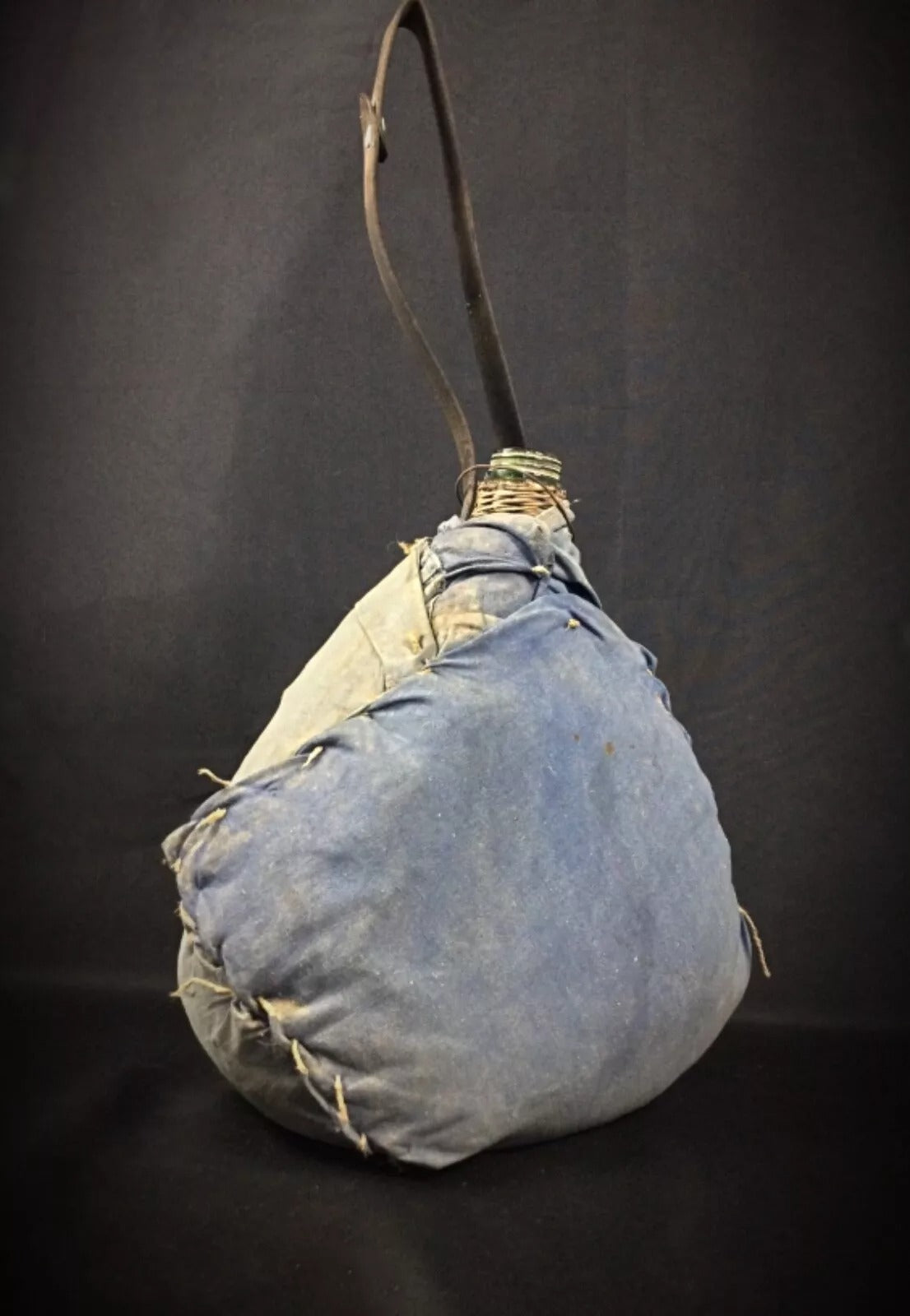 Top-down view looking into the opening of the demijohn bottle.

