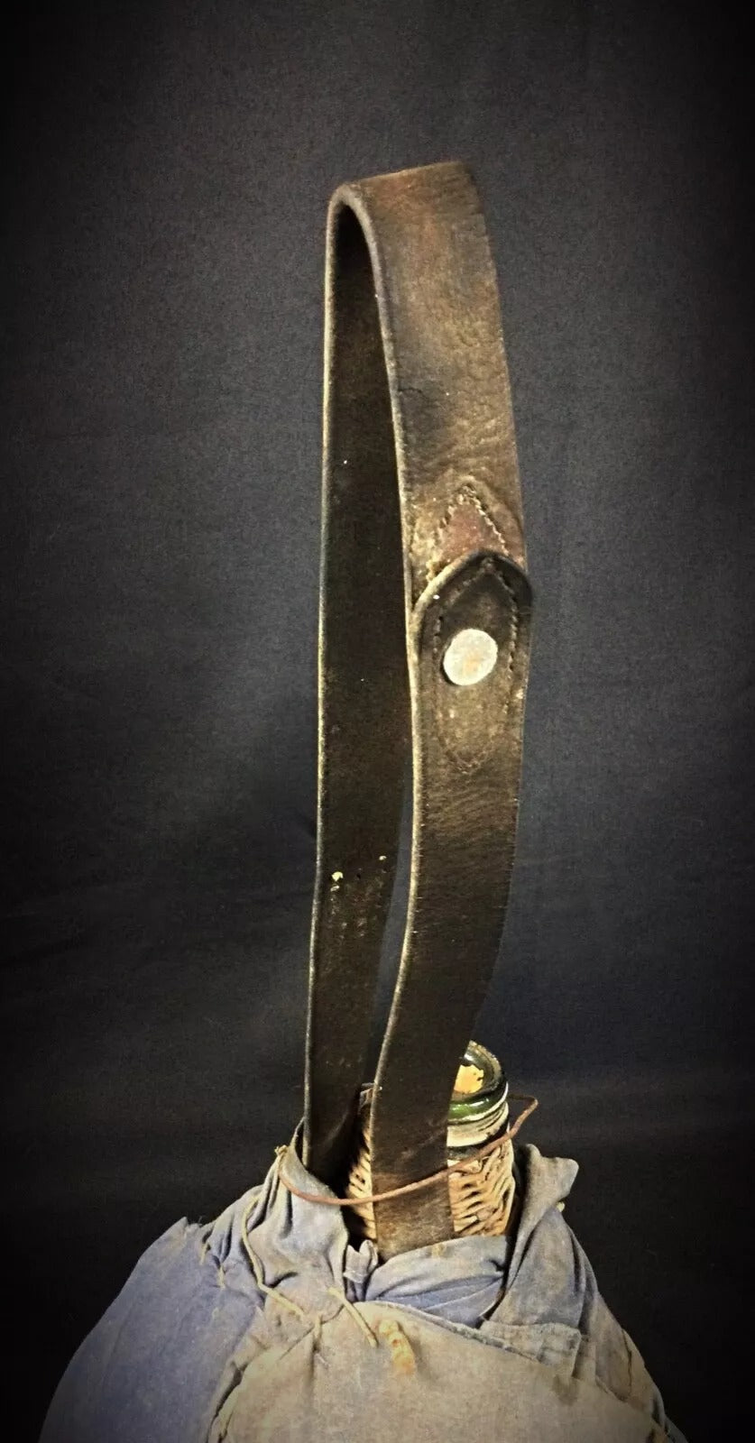 Angle shot capturing the demijohn's substantial size and rustic presence.

