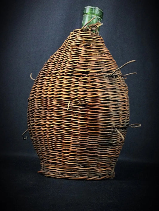 Close-up detail of the hand-woven wicker texture and its rustic patina.

