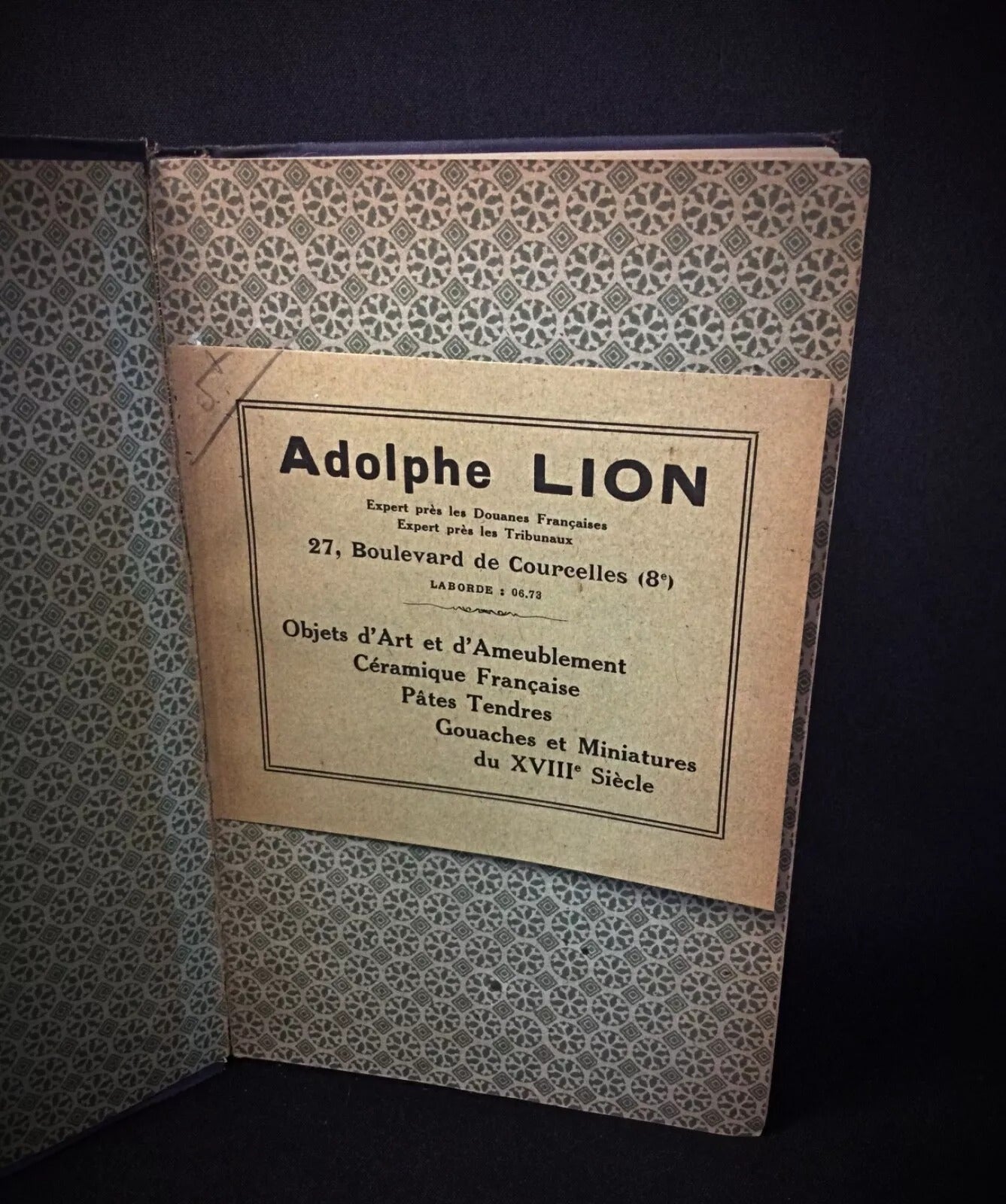 Shot of the book's spine, showing its age and binding.

