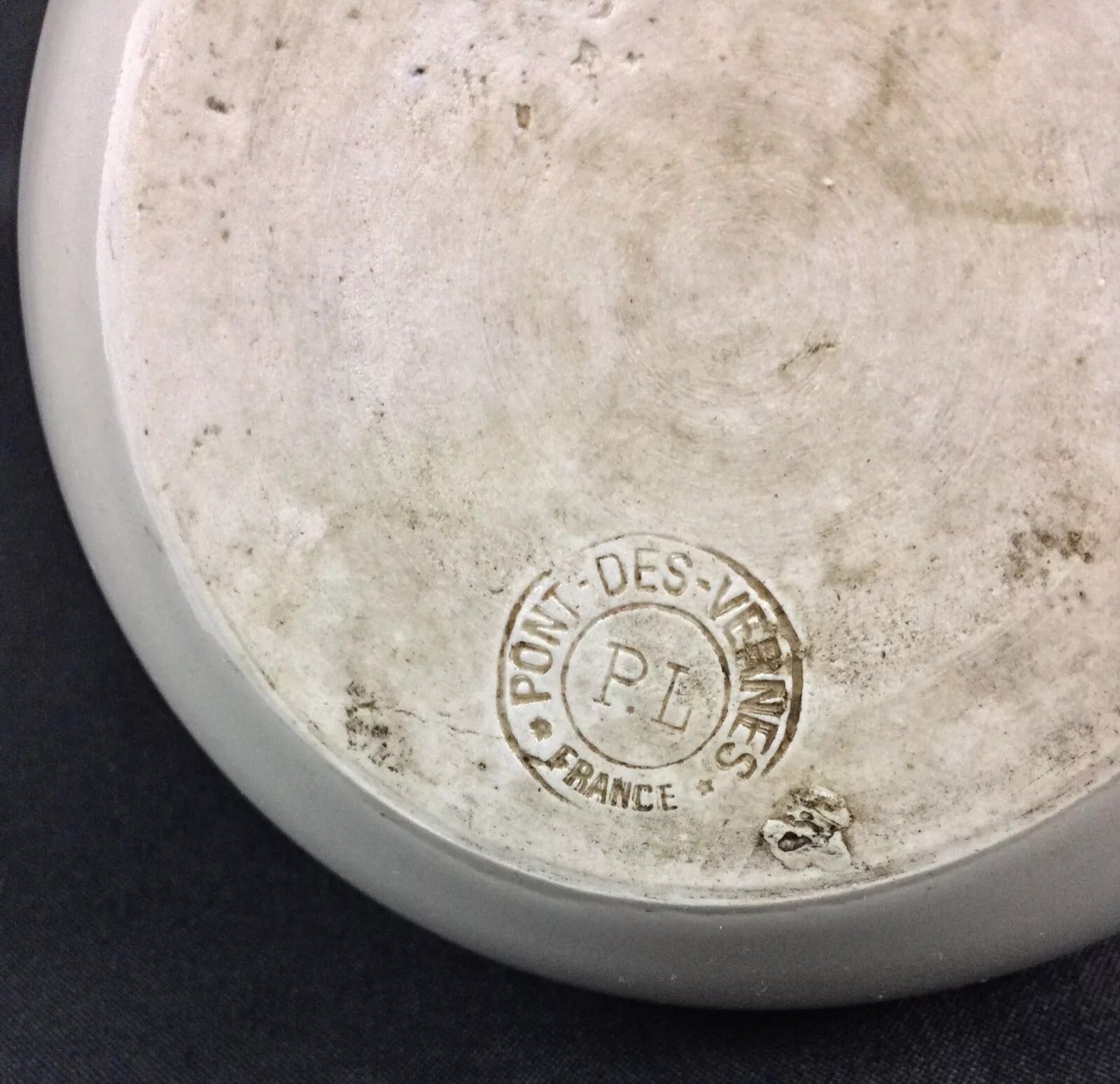 Close-up detail of the "Mon Fillion" inscription on the pitcher

