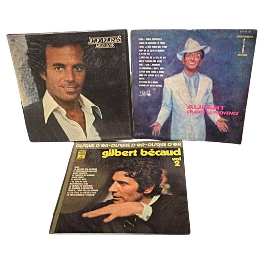 Lot of 3 vintage vinyl records featuring Gilbert Bécaud, Julio Iglesias, and Alibert.
