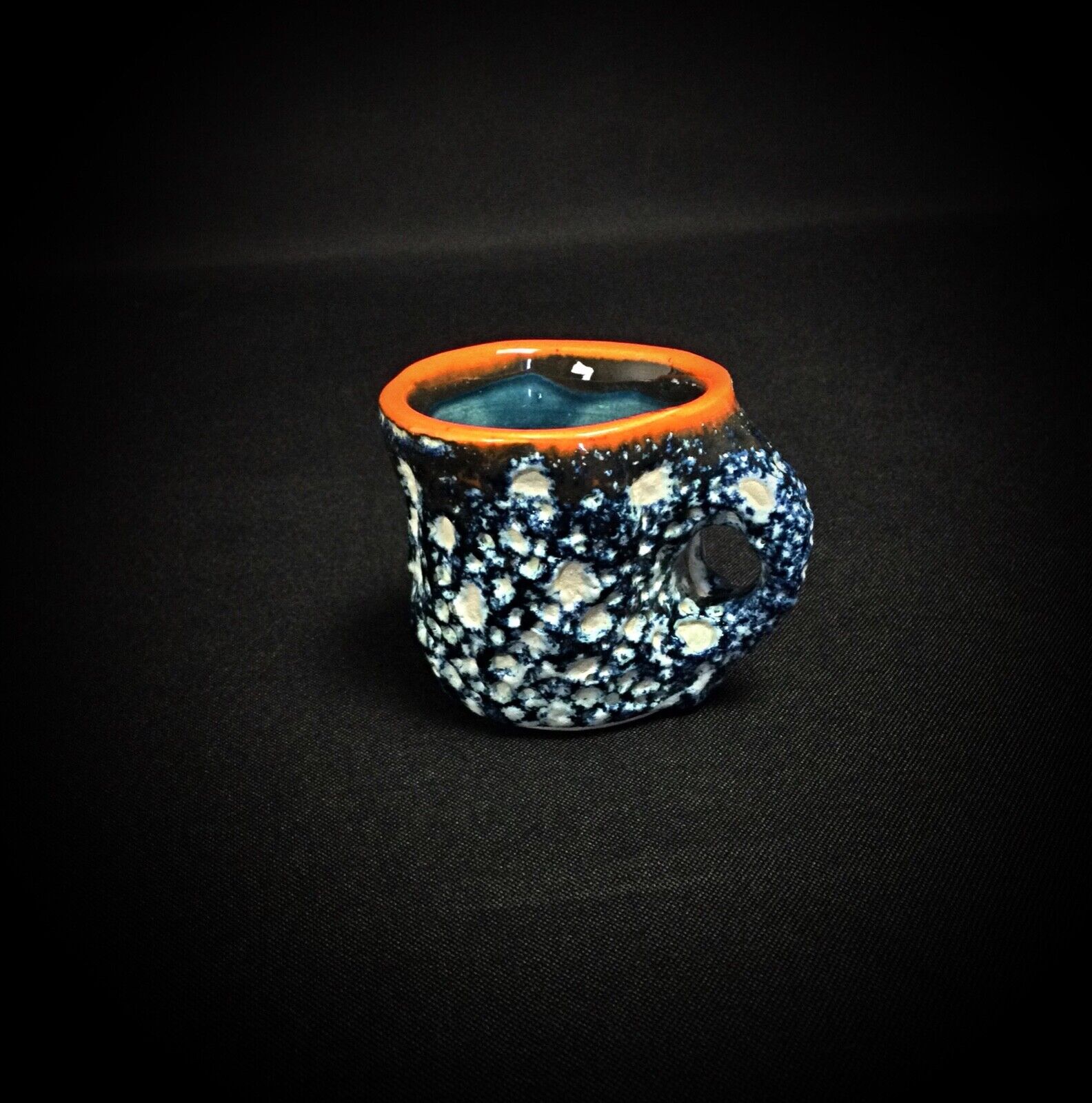 Artistic details on vintage Vallauris ceramic drinkware set

