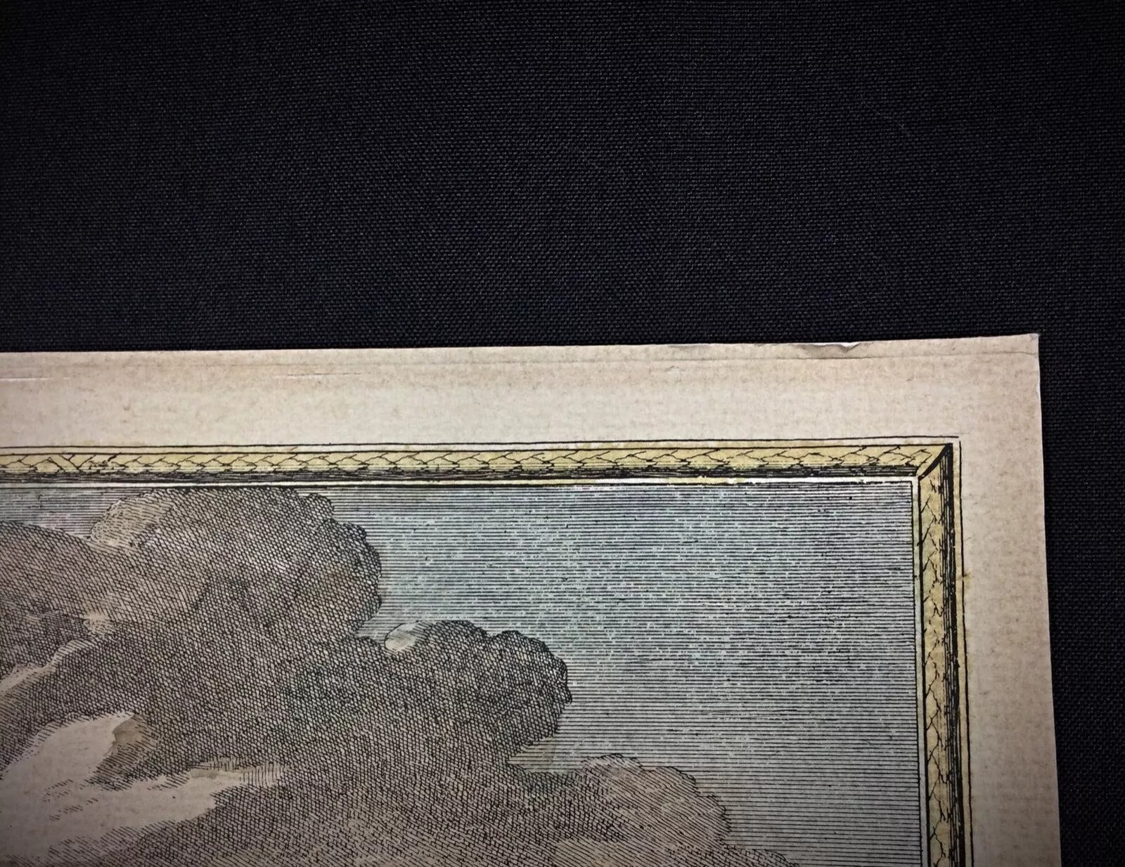 Close-up of detailed imagery showing craftsmanship of early 20th century printmaking