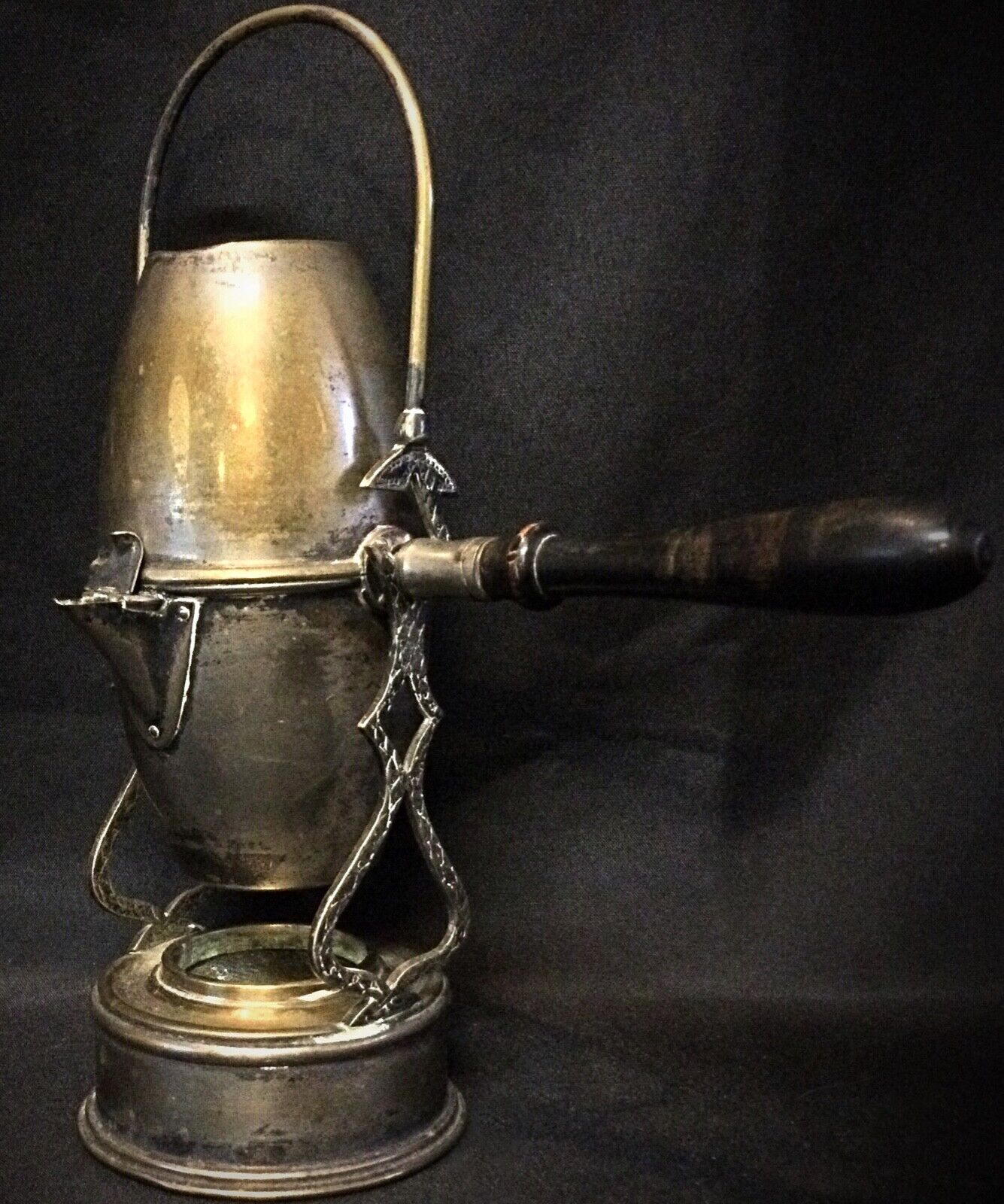 Intricate detailing on the antique brass coffee pot from the early 20th century
