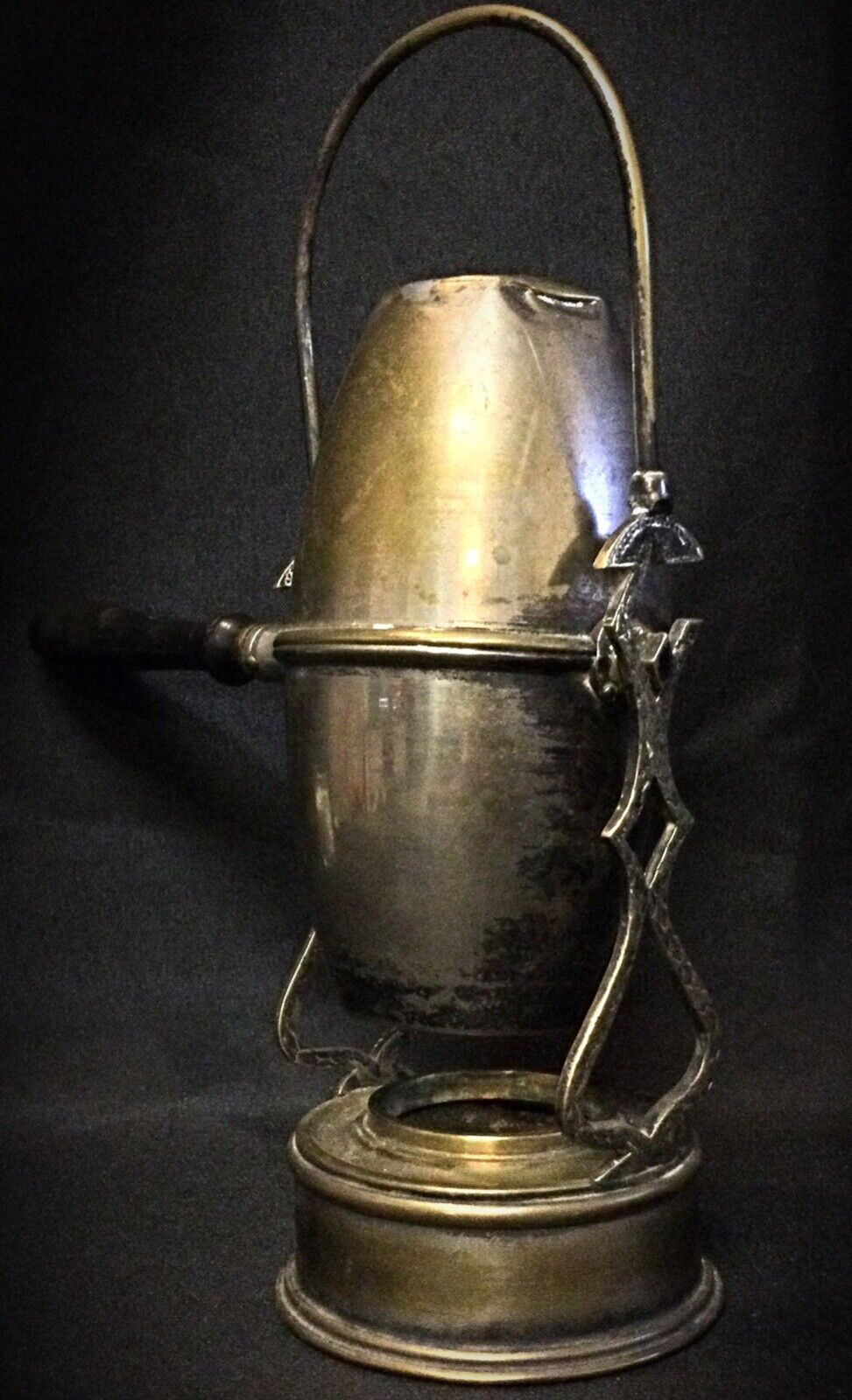 Patinated brass and copper coffee pot showing its age and charm
