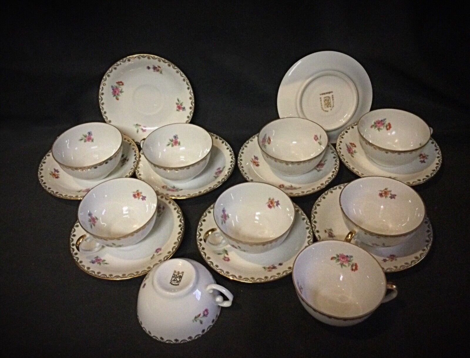 Classic French coffee cup with intricate floral detailing and gold trim
