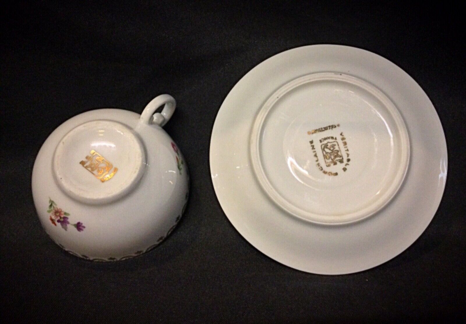 Side view of porcelain coffee cups highlighting their elegant curved handles
