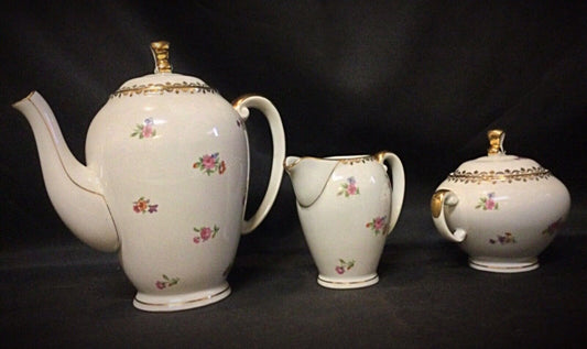 Elegant vintage French porcelain coffee set with classic design
