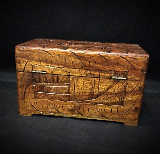 Elegant vintage wooden storage box with ornate carving

