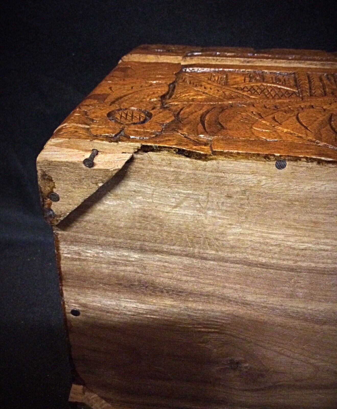 Decorative wooden keepsake box placed on a wooden table
