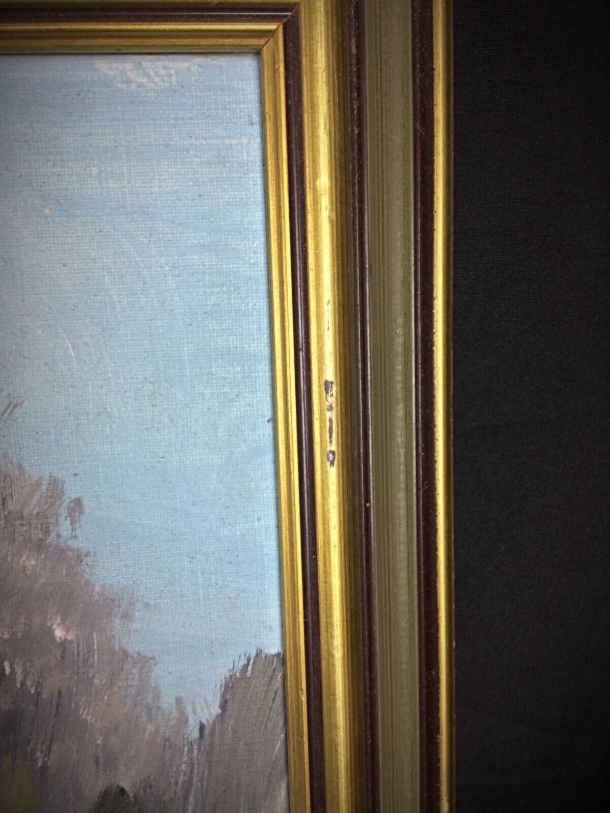 Framed landscape painting – riverside town
