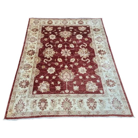 Handmade Vintage Afghan Zigler Rug - 1980s - Wool rug showcasing intricate patterns in deep red and cream tones.